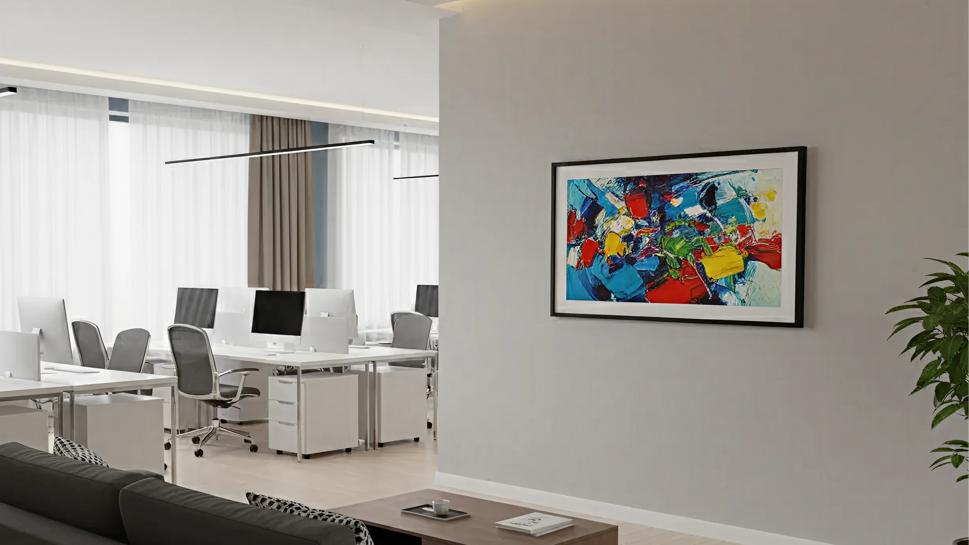 Modern office space with a colorful abstract painting on the wall.